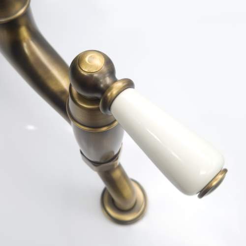 Bidbury and Co Moreton Twin Lever Patinated Brass Bridge Tap with Porcelain Handles